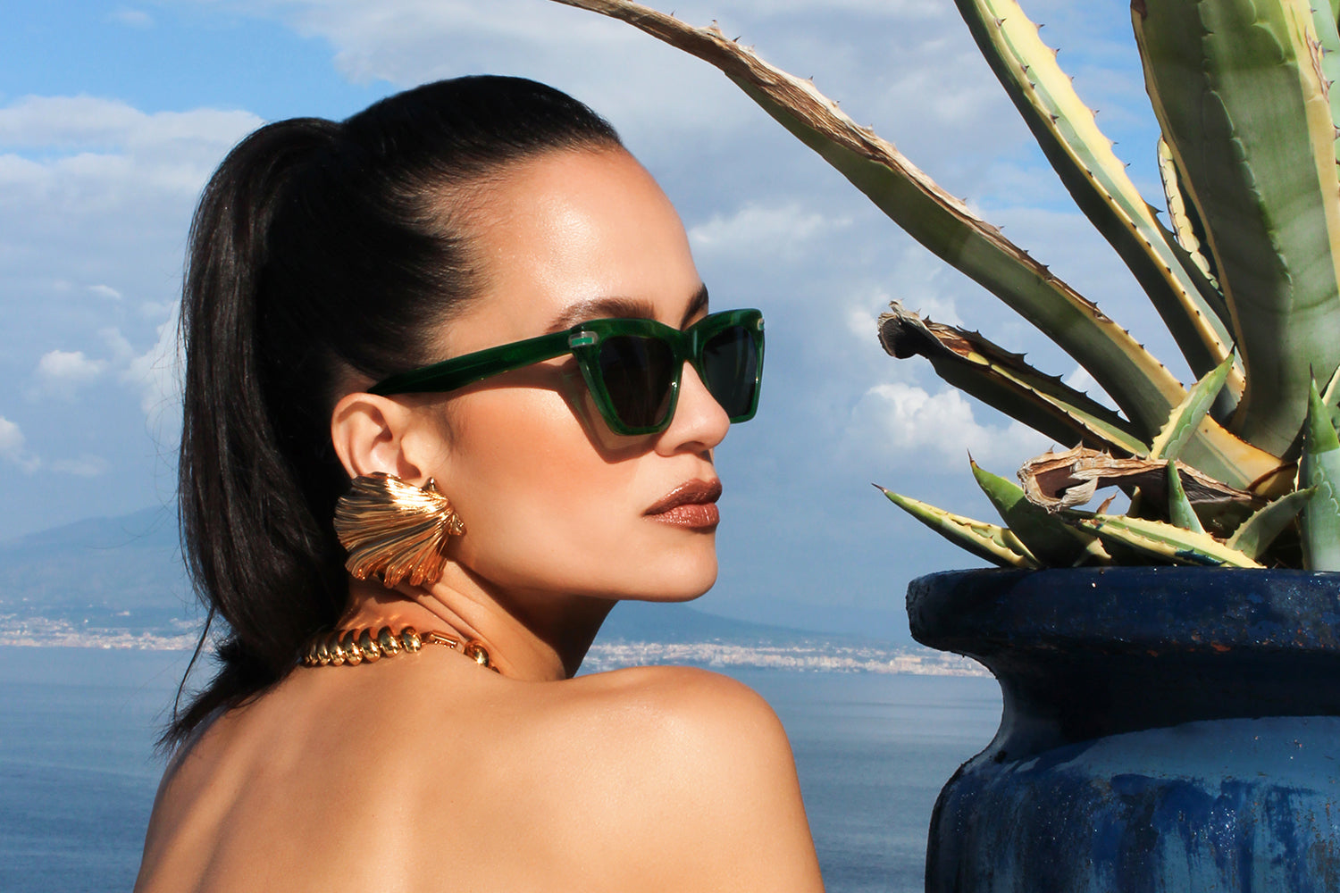 Vert acetate sunglasses with dark green lenses and gold tone hardware