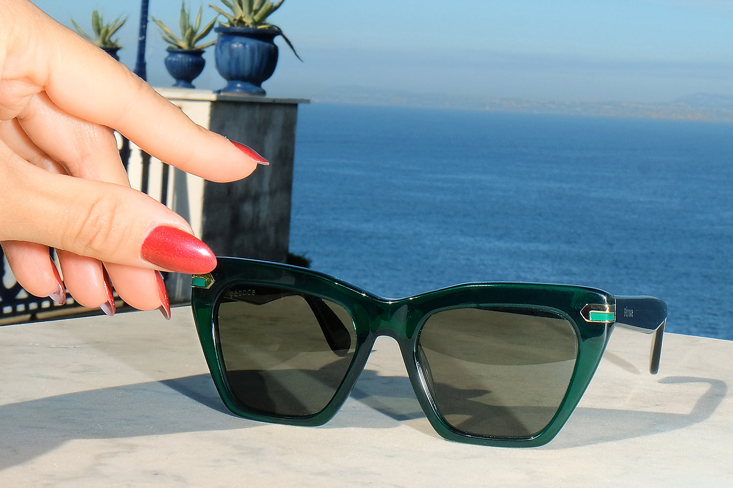 Vert acetate sunglasses with dark green lenses and gold tone hardware