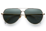 Gold titanium sunglasses with green lenses and gold tone hardware