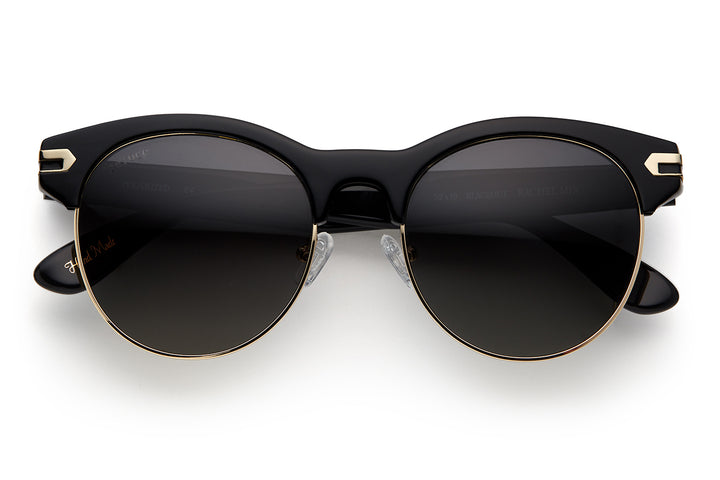 Black acetate sunglasses with stainless steel bottom rim with dark grey lenses and gold tone hardware