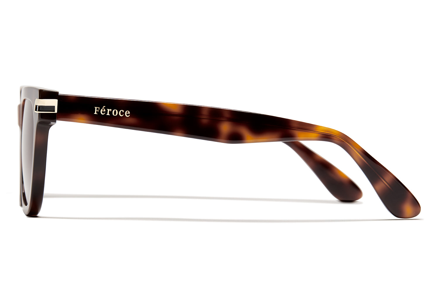 Tortue acetate sunglasses with dark brown lenses and gold tone hardware