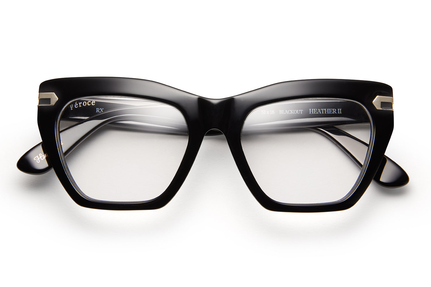 Black acetate glasses with clear lenses and gold tone hardware