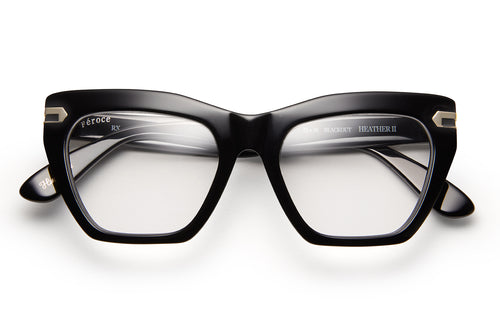 Black acetate glasses with clear lenses and gold tone hardware