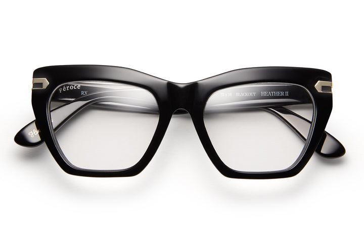 Black acetate glasses with clear lenses and gold tone hardware