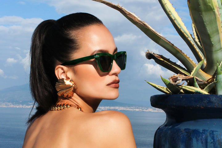 Vert acetate sunglasses with dark green lenses and gold tone hardware