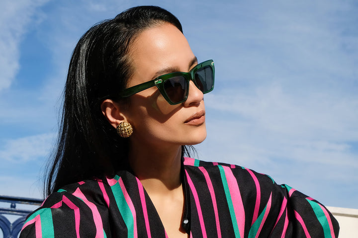 Vert acetate sunglasses with dark green lenses and gold tone hardware
